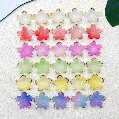Colorful flower charms arranged on a light background