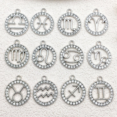 Metallic assorted shape charms arranged on a light background