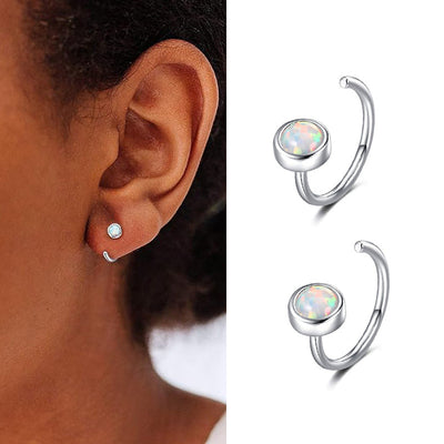 Faux opal open hoop earring on ear plus product pair on white