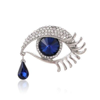 Front product view of the eye brooch pin in silver and blue