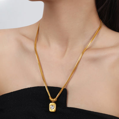Gold heart zircon square pendant necklace worn on collarbone