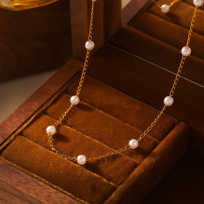 Gold imitation pearl station necklace in velvet box
