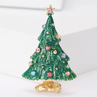 Front view of the decorated christmas tree enamel brooch in green and white brooch and its color options