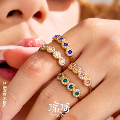 Styled hand view of crystal circle open rings in main image 1.