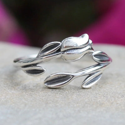 Antique silver tulip leaf open adjustable ring on stone with pink bg