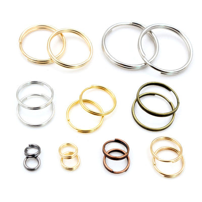 Assorted double-loop split jump rings in mixed sizes and finishes arranged together in the main product view