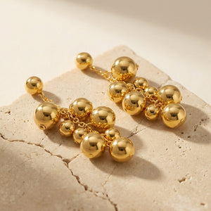 Graduated Metal Ball Cluster Drop Earrings in Polished Gold Tone