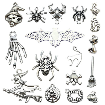 Silver-tone assorted shape charms arranged on a light background