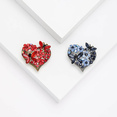 Product display showing an open heart filled with faceted crystals and a small butterfly