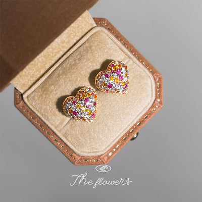 Multicolor pave heart studs in open brown jewelry box