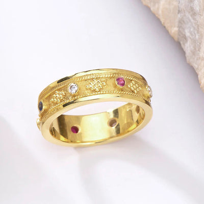 Gold multicolor CZ embossed floral band ring angled studio