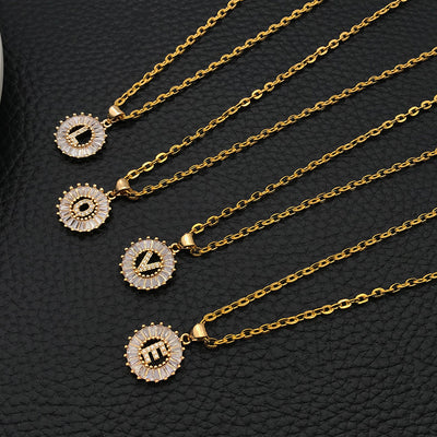Black alphabet letter charms arranged on a light background
