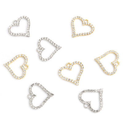 Assorted heart charms arranged on a white surface