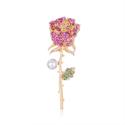Front product view of the rose brooch pin in gold and pink