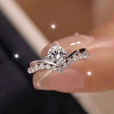 Silver split shank bypass ring with center clear CZ on finger tip