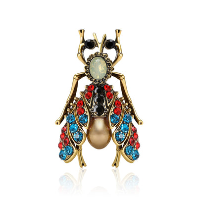 Front view showing the antique gold insect brooch with multicolor crystal wings
