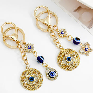 Gold-Tone Evil Eye Keychains with Blue Charms in Twelve Designs