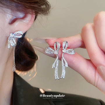 Crystal Bow Tassel Earrings with Asymmetric Silver Tone Drops