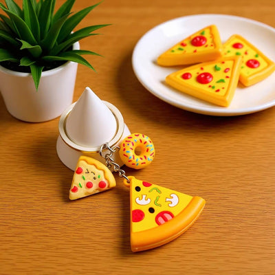 Main display of pizza fries burger baguette and hot dog food keychains