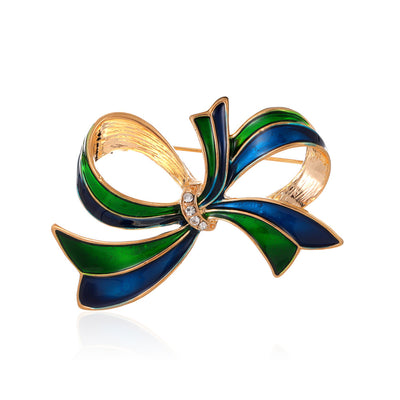 Front product view of the ribbon bow brooch pin in gold and blue