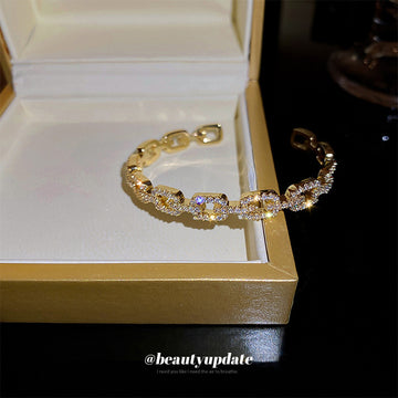 Gold Tone Open Cuff Bracelet With Crystal Buckle Link Pattern