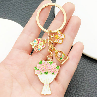 Front display of six Mother's Day floral multi charm keychains with visible colors and attached hardware