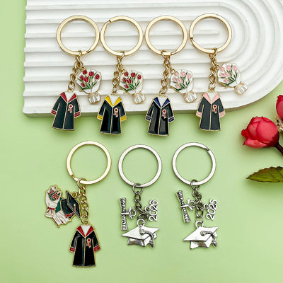 Image 1 showing a set of four key chains with different designs.