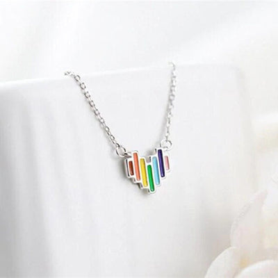 Silver rainbow stripe heart pendant necklace on white prop