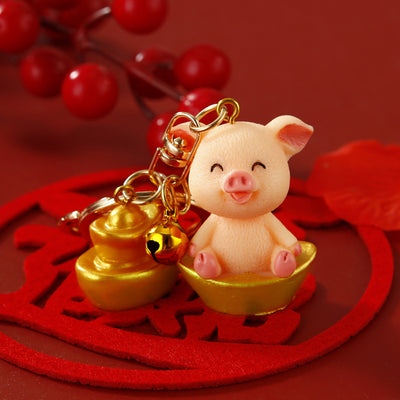 Main image 1 shows a supplied presentation of cute ingot pig keychains with visible attached key hardware.