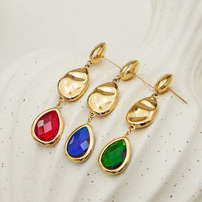 Blue green and red teardrop glass gold drop earrings flat lay
