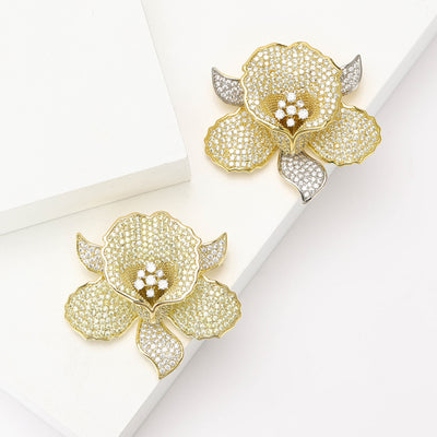 Product display showing a five-petal flower densely set with clear stones and a crystal center