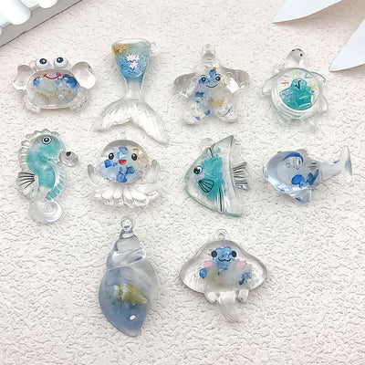 Blue seashell charms arranged on a light background