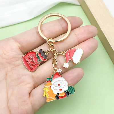 Image 1 showing a hand holding two different key chains.