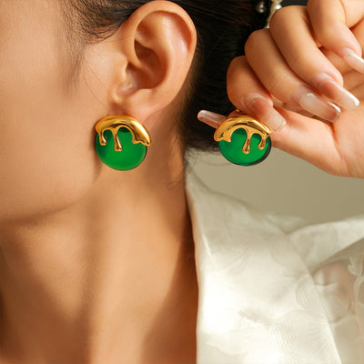 Model wearing green resin ice cream drip stud earrings gold metal tops