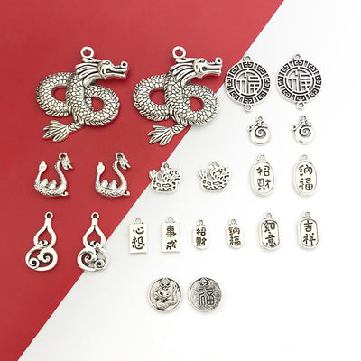 Red assorted shape charms arranged on a light background