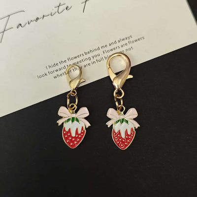 Main product view of strawberry Bow Shoe Charms with Two Gold Tone Lobster Clasps