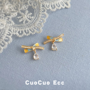 Gold Tone Clear Stone Ribbon Bow And Teardrop Stud Earrings