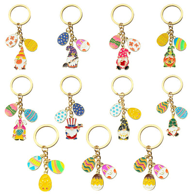 Clean white background catalog view of ten holiday gnome and Easter egg keychains