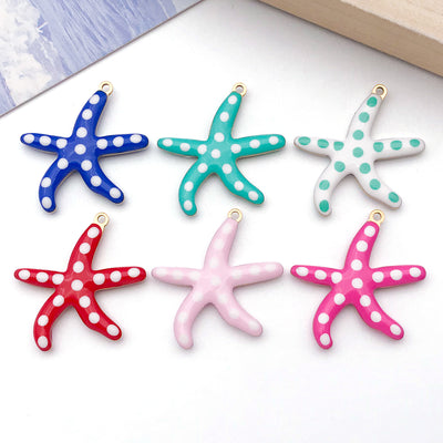 Colorful starfish charms arranged on a light background