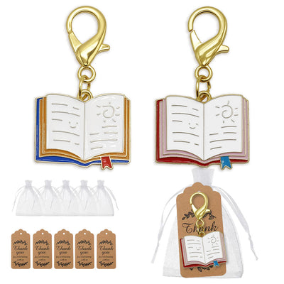 Two open book enamel charms with organza bags and kraft tags