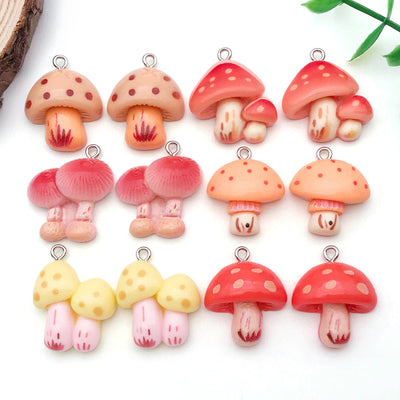 Multicolor mushroom charms arranged on a light background