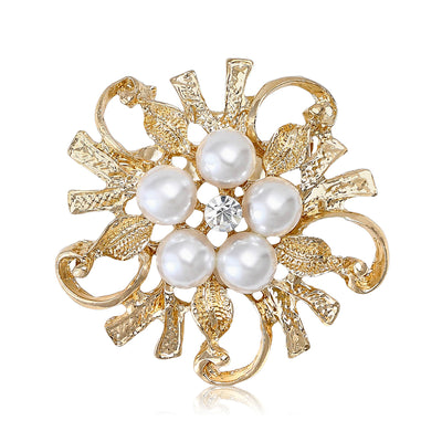 Front product view of the floral cluster of white pearls set over sculpted curling leaves brooch
