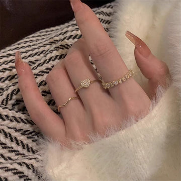 Gold Tone Three Piece Crystal Heart Wave And Textured Ring Set