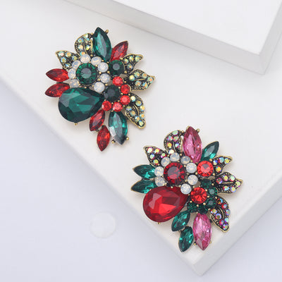 Front view showing the antique gold floral cluster brooch with red or green crystals