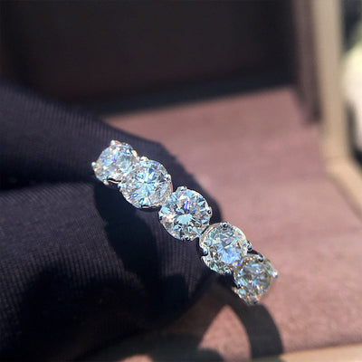 Product view showing silver-tone five round-stone ring