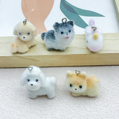 Multicolor dog charms arranged on a light background