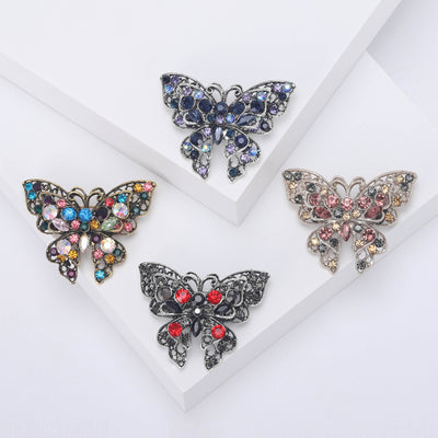 Front view of vintage style crystal butterfly brooch in four colorways