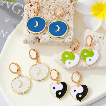Gold Tone Huggie Earrings with Crescent and Yin Yang Heart Drops