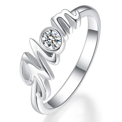 White gold cursive Mom script ring with clear round CZ close-up