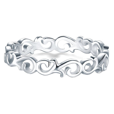 Silver openwork scroll vine band ring close front on white
